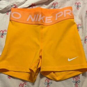 Nike Pro Women's Bright Yellow Athletic Shorts with Peach Waistband